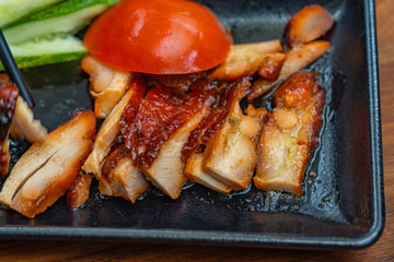 Chinese styled honey grilled pork belly slices on the plate