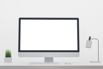 Minimalistic designer desk with empty computer screen
