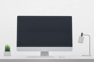 Designer desktop with black pc screen