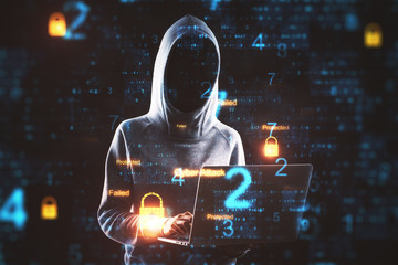 Hacker using laptop.