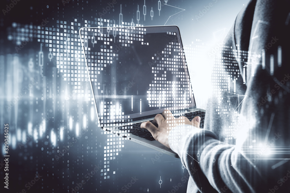 Aufkleber Hand using laptop with glowing global stock statistics.