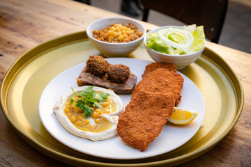 Israel 2020 Typical Israeli dish, schnitzel hummus and salad
