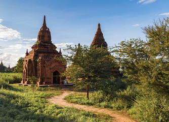 Fototapeta na wymiar Ancient Buddhist pagodas in Bagan, Myanmar (Burma). The pathway leading to the entrance. Travel Asia.
