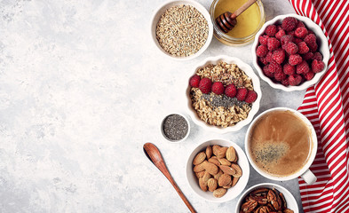 healthy breakfast, oatmeal with raspberries and honey, top view