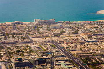 Fototapeta na wymiar sea view in Dubai city, construction cranes