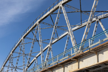 Steel bridge frame close. Bridge over the winter river