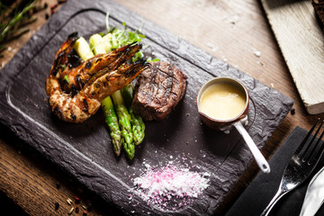 Tasting menu. Beef steak and grilled tiger prawns.