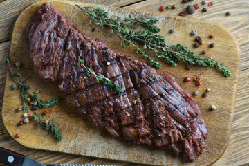 skirt steak on a wooden background