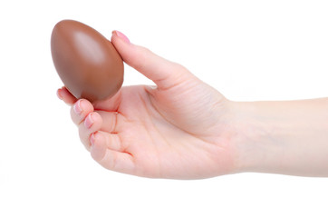 Hand holding chocolate egg sweet candy dessert on white background isolation