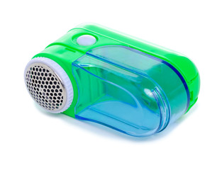 Green wool clothes fabric shaver on white background isolation