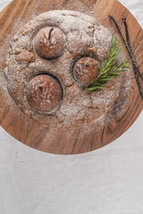 Delicious spice cake with pear, ginger and cinnamon on a white kitchen counter.