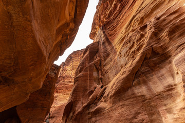 Passage through Sik canyon to the temple-mausoleum of Al Khaznen in the city of Petra in Jordan. 