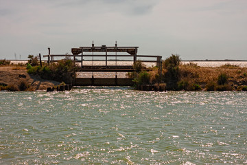 Obraz premium A lock closes the water flows in the lagoons of Camargue, France.