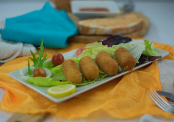 Chicken croquettes in dish on the table