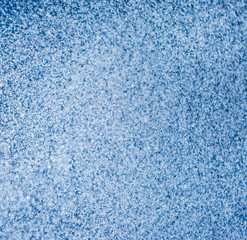 Fototapeta na wymiar clear and fuzzy drops of water on a blue background