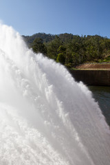 Rushing water from Tinaroo Falls Dam on the Atherton Tableland in Queensland, Australia