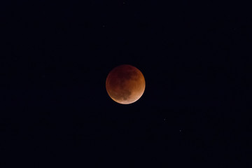 A lunar Eclipse on a black sky