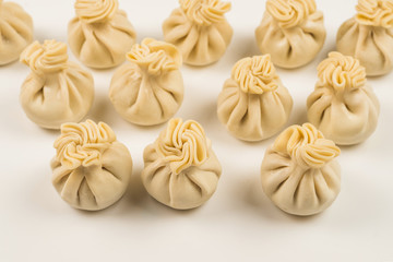 Khinkali on white background.