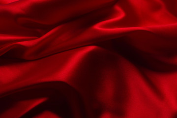 Naklejka na ściany i meble Red silk or satin luxury fabric texture can use as abstract background.