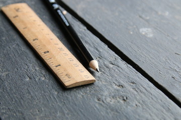 wooden ruler lies on a vintage table