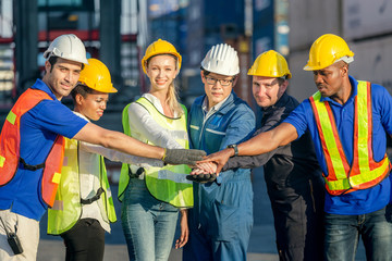 Success Teamwork Concept, Business people engineer and worker team joining hands.