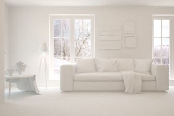 Mock up of stylish room in white color with sofa and winter landscape in window. Scandinavian interior design. 3D illustration