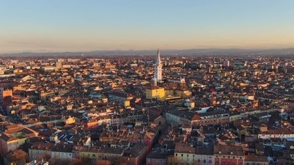 modena city centre aerial view drone fly orbit over downtown at sunset 4k