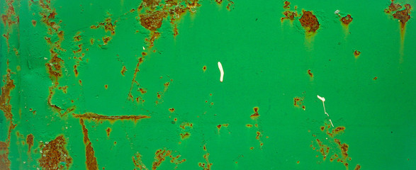 Rusty green painted peeled metal wall texture background, with space for text