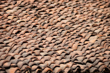 old clay roof tiles close up as background