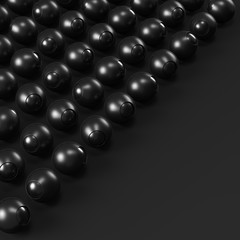 Array of black abstract spheres on dark background.