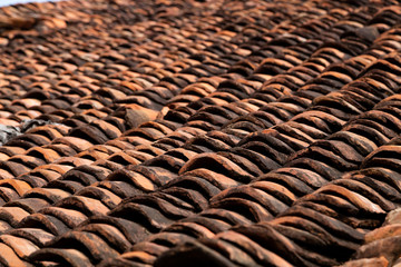 old clay roof tiles close up as background