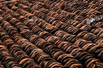old clay roof tiles close up as background
