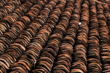 old clay roof tiles close up as background