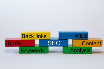 colorful blocks with the words: SEO, WEB. Content, Analyses, Keywords, Traffic, Back links, are isolated against a white background with space for text