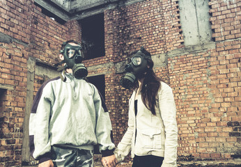 environmental disaster couple in love wearing gas mask