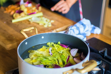 Casserole on the plate with vegetable soup
