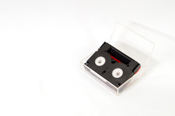 Digital video cassette in cover for video graphy for backdated handycam or video camera isolated on white background