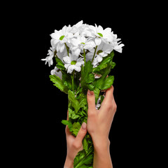 A bouquet of flowers in hands isolated