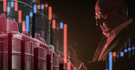 A man is studying the oil and gas sector. An investor explores the oil industry. Concept - reports...