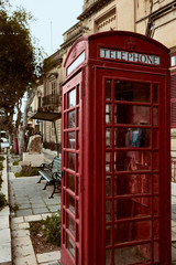 Fototapeta na wymiar Red telephone box, Gzira, Malta