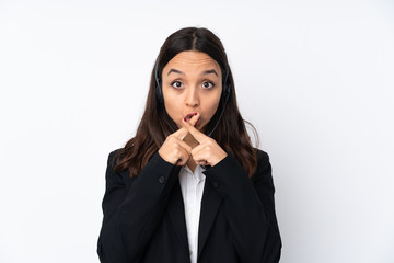 Young telemarketer woman isolated on white background showing a sign of silence gesture