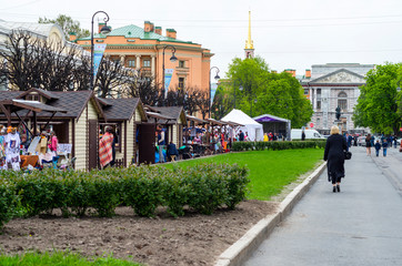 City street fair on the maple street, the sale of various goods, St. Petersburg, Russia, May 14, 2017