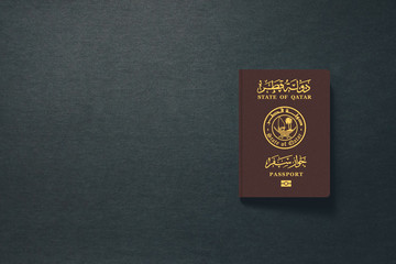 Qatar Passport on dark background with copy space - 3D Illustration