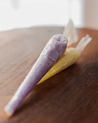 package of purple and yellow bath salts for relaxing spa treatments with white background