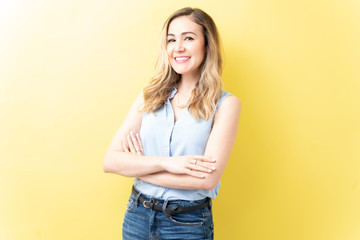 Happy Caucasian Woman Standing With Arms Crossed