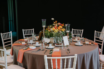 Beautiful, decorated table with flower decorations.  Wedding or party decorations.