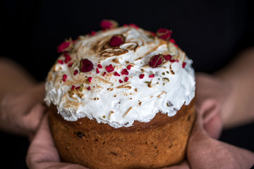 Easter composition with sweet bread, kulich and eggs on light background.