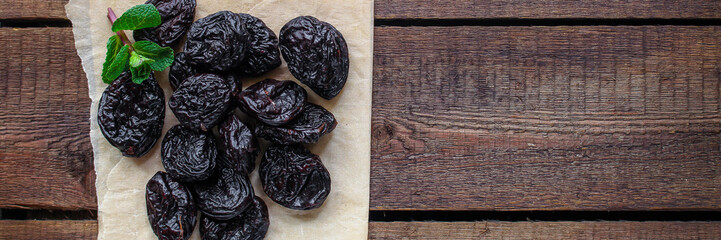 prunes, dried plums (tasty and healthy fruits) desiccated keto or paleo diet menu concept....