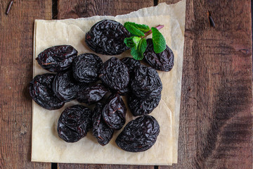 prunes, dried plums (tasty and healthy fruits) desiccated keto or paleo diet menu concept. background. top view. copy space
