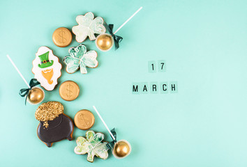 March 17 is St. Patrick's Day. Composition of sweet gingerbread on a light background.